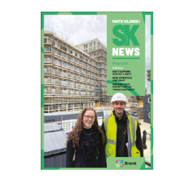Magazine cover showing two people standing at a construction site