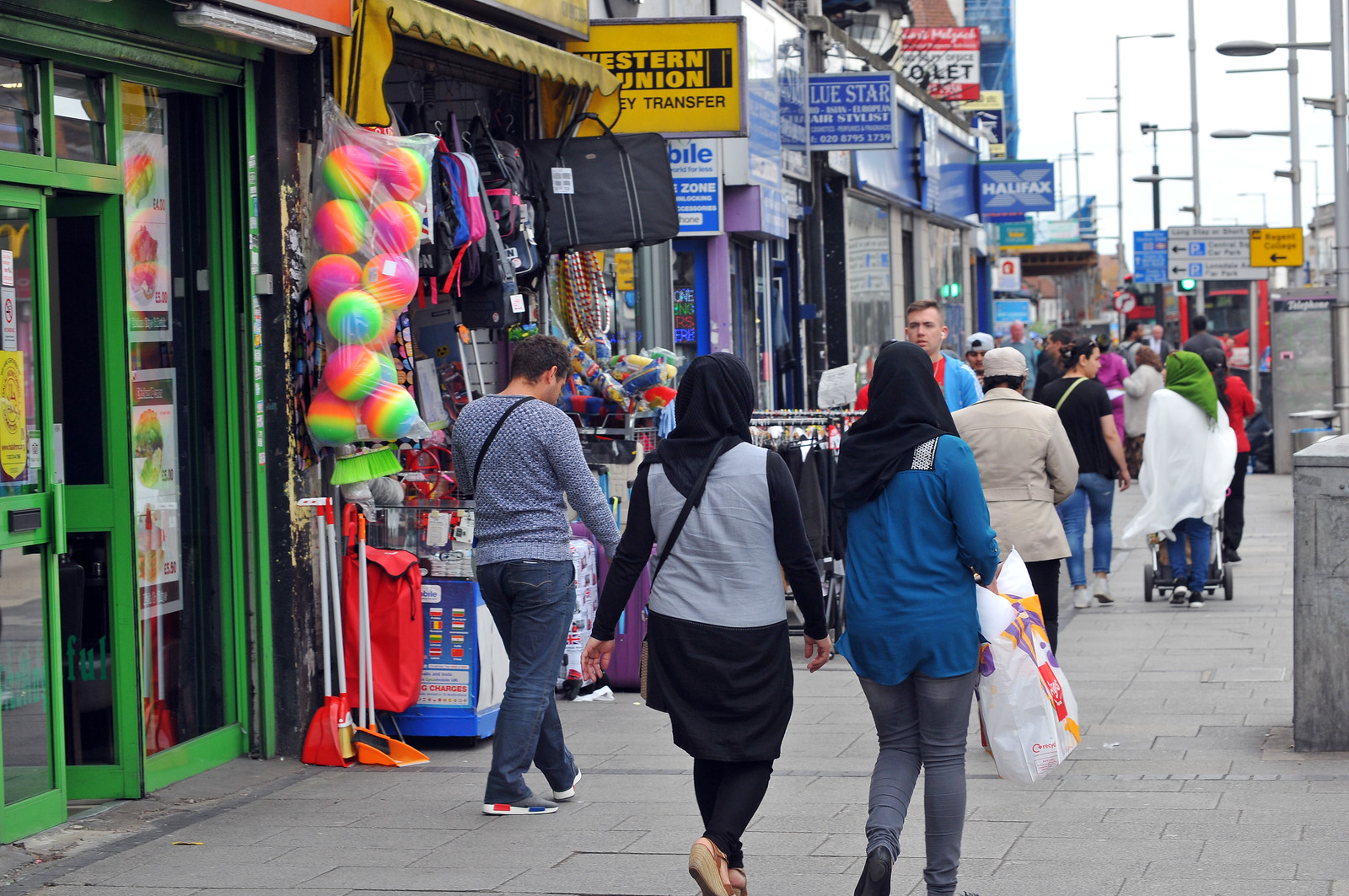 People walking up Wembley High Road