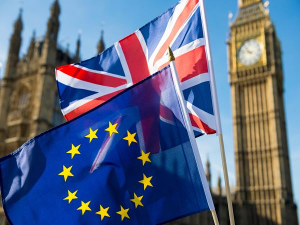 European Union and British Union Jack flag flying in front of Big Ben and Houses of Parliament