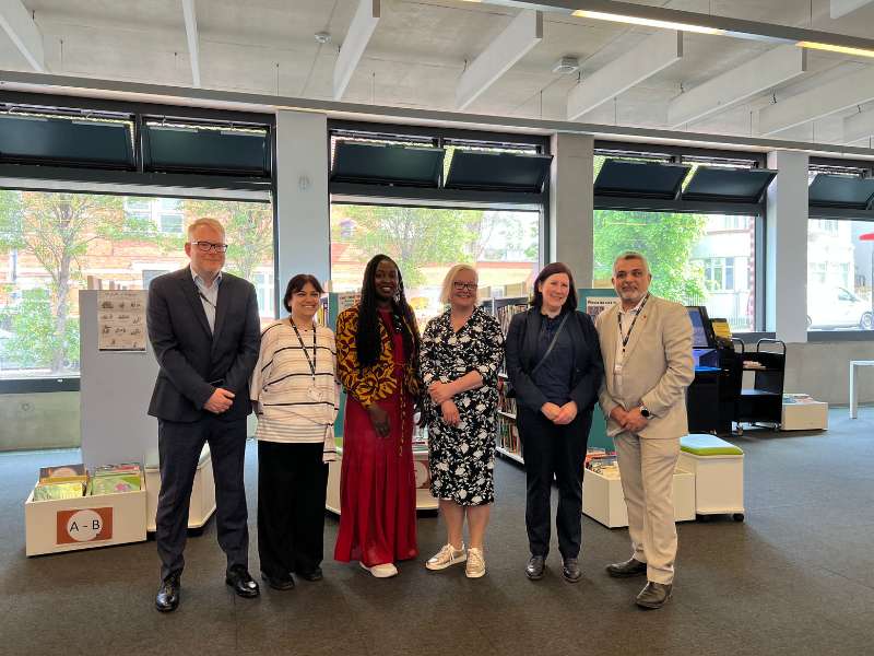 Baroness Fiona Twycross standing in the Harlesden hub, alongside The Leader, Cllr. Butt and the Corporate Director for Resident Services