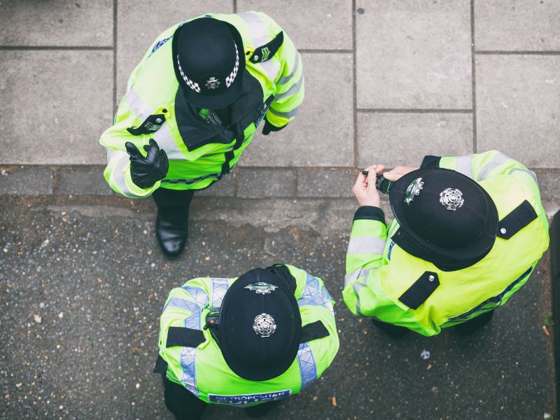 Police officers gathered in a circle