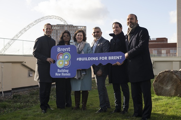 People standing on the roof on top of a building
