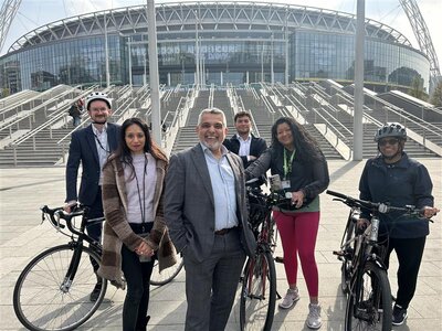 Cllr Butt and Sheth with cyclists outside Wembley Stadium