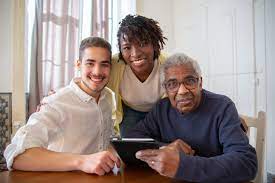 Three people sitting and smiling