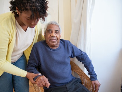 carer supporting elderly person