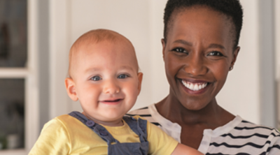 Photo of a woman holding a toddler