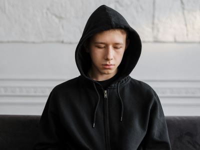 Image of a teenager looking sad