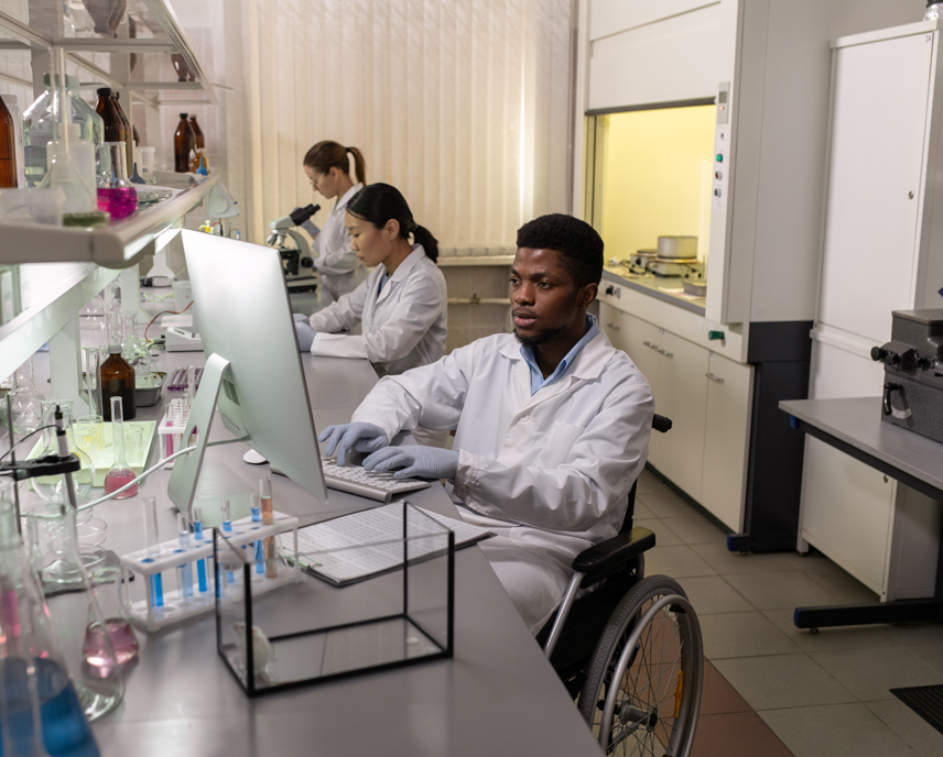 Young man in a wheelchair in a science lab