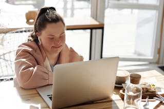 young person using laptop