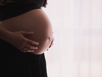 Pregnant woman showing  baby bump