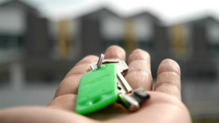 A hand holding a set of keys