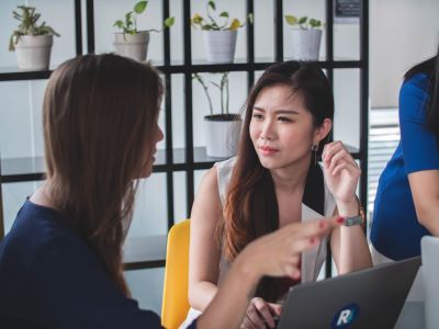 two women having a meeting over a laptop