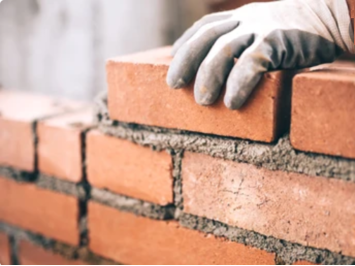 Bricks being built in to a wall